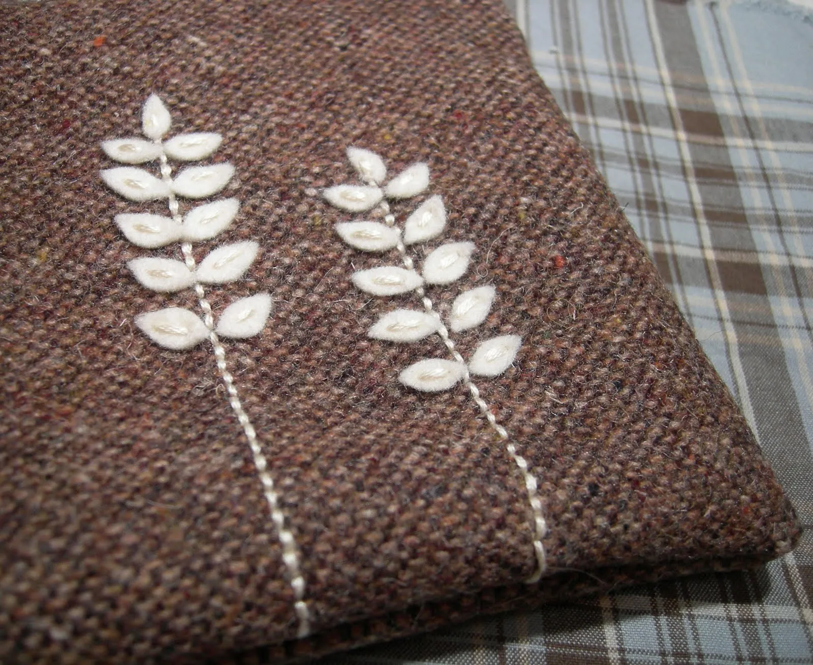 The little leaves are so tiny, they each took one stitch each. Definitely not something you can leave to bang around the bottom of your purse!